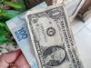 Dólar fecha a R$ 5,35 e atinge menor valor em 15 meses
